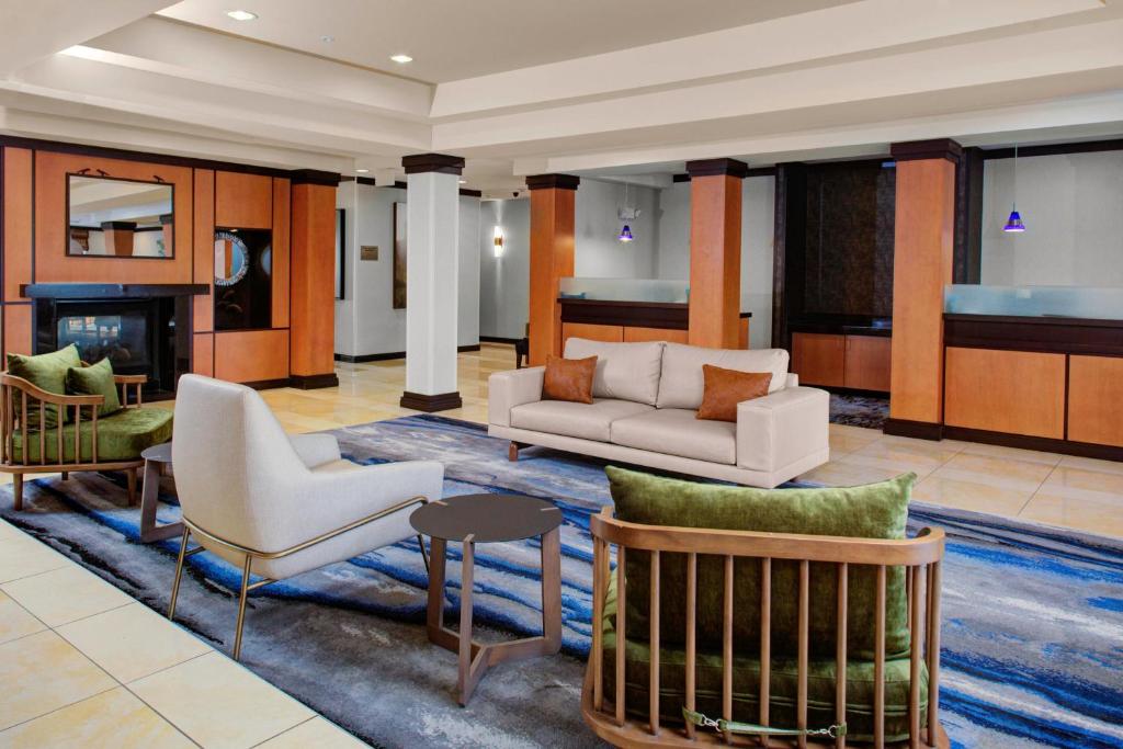 a living room with furniture and a fireplace at Fairfield Inn & Suites Indianapolis Avon in Avon