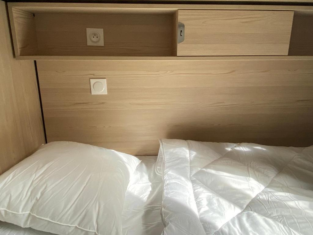 Un ou plusieurs lits dans un hébergement de l'établissement YASI Hostel