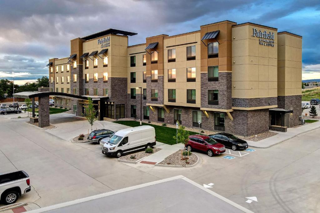 an aerial view of a hotel with cars parked in a parking lot at Fairfield by Marriott Inn & Suites Denver Southwest, Littleton in Littleton