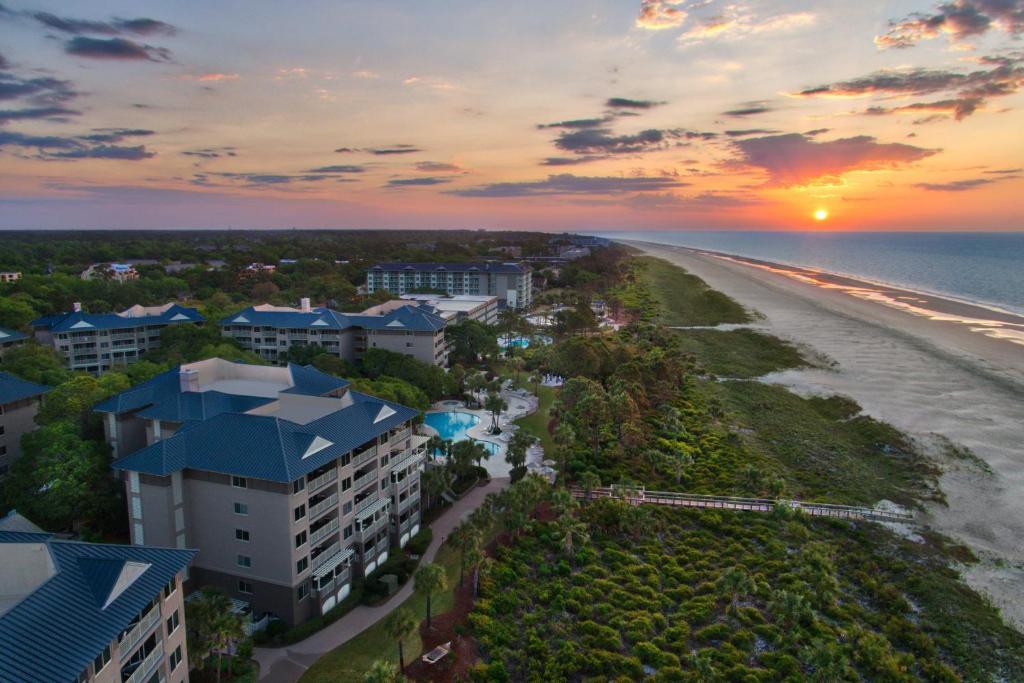 an aerial view of a resort and the beach at sunset at Marriott's Grande Ocean in Hilton Head Island