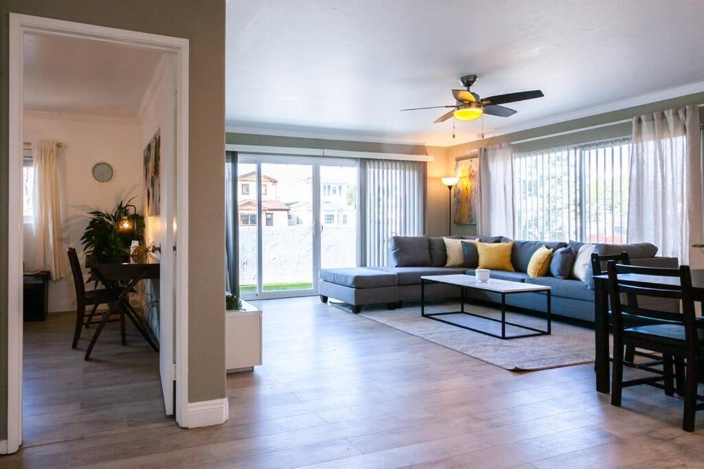 a living room with a couch and a table at Modern Beach Oasis in San Diego