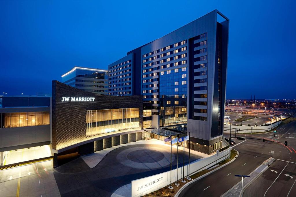 a large building with a sign on it at night at JW Marriott Minneapolis Mall of America in Bloomington