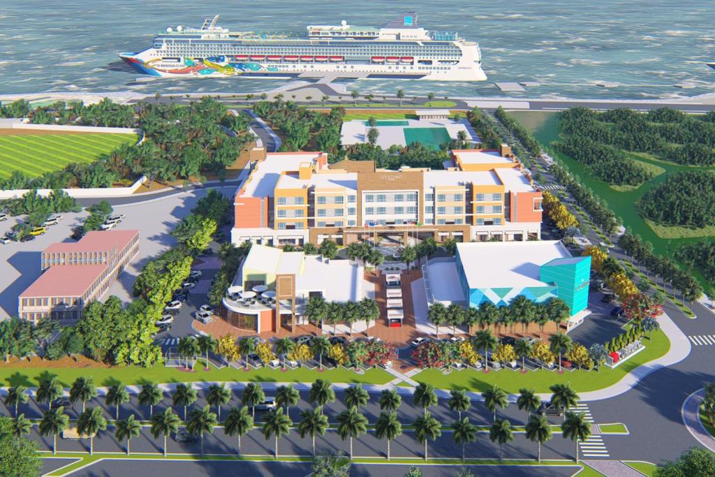 a rendering of the resort with a cruise ship in the background at Courtyard by Marriott Curacao in Willemstad