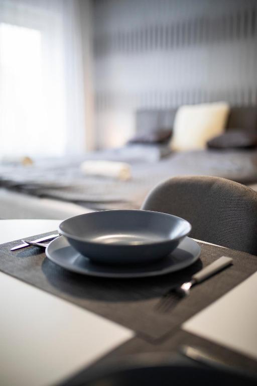 Łóżko lub łóżka w pokoju w obiekcie Csipke Apartman