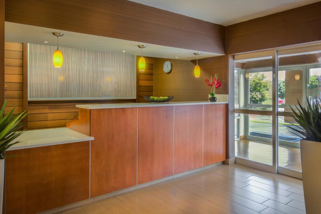 a kitchen with wood paneling and a counter with plants at Fairfield Inn Richmond Chester in Chester