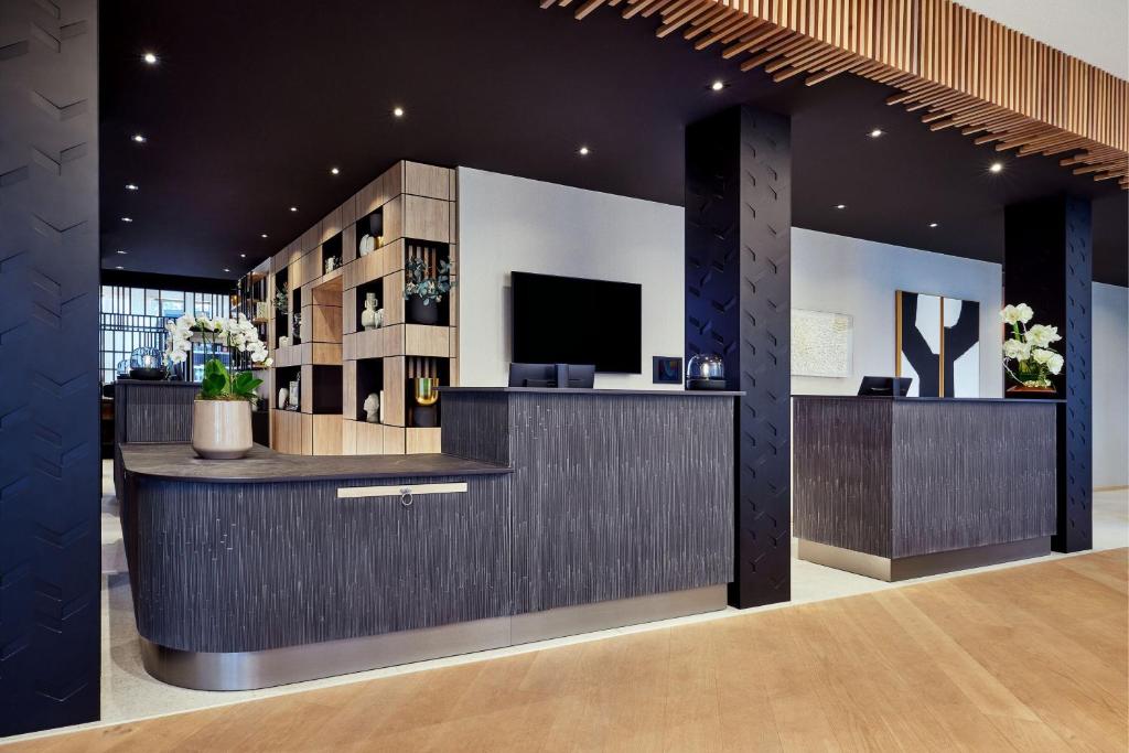 TV a/nebo společenská místnost v ubytování AC Hotel by Marriott Strasbourg