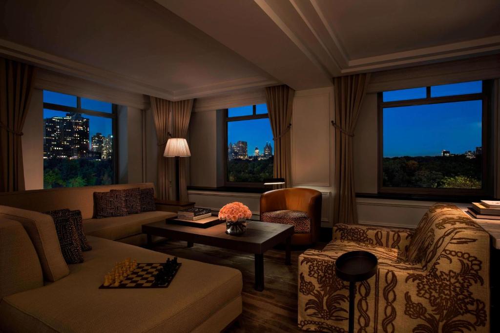 a living room with a couch and a table at The Ritz-Carlton New York, Central Park in New York