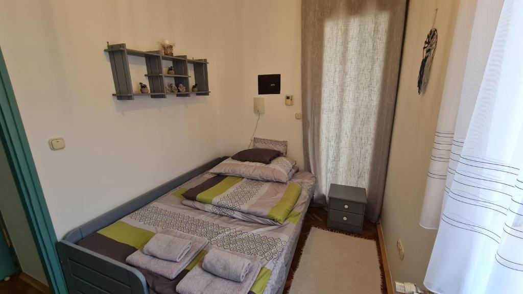 Postel nebo postele na pokoji v ubytování RI-JÓ apartman