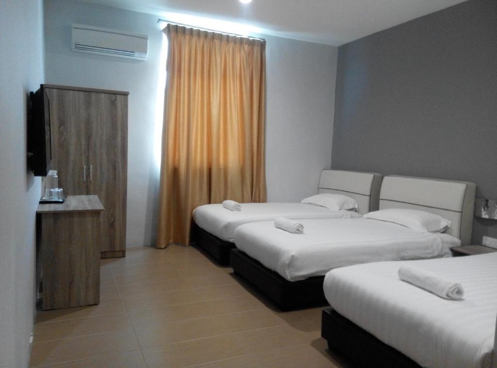 Postel nebo postele na pokoji v ubytování Welcome Inn GM