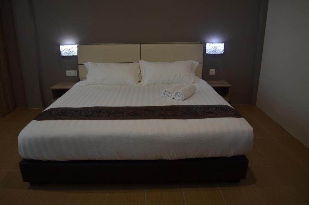 Postel nebo postele na pokoji v ubytování Welcome Inn GM