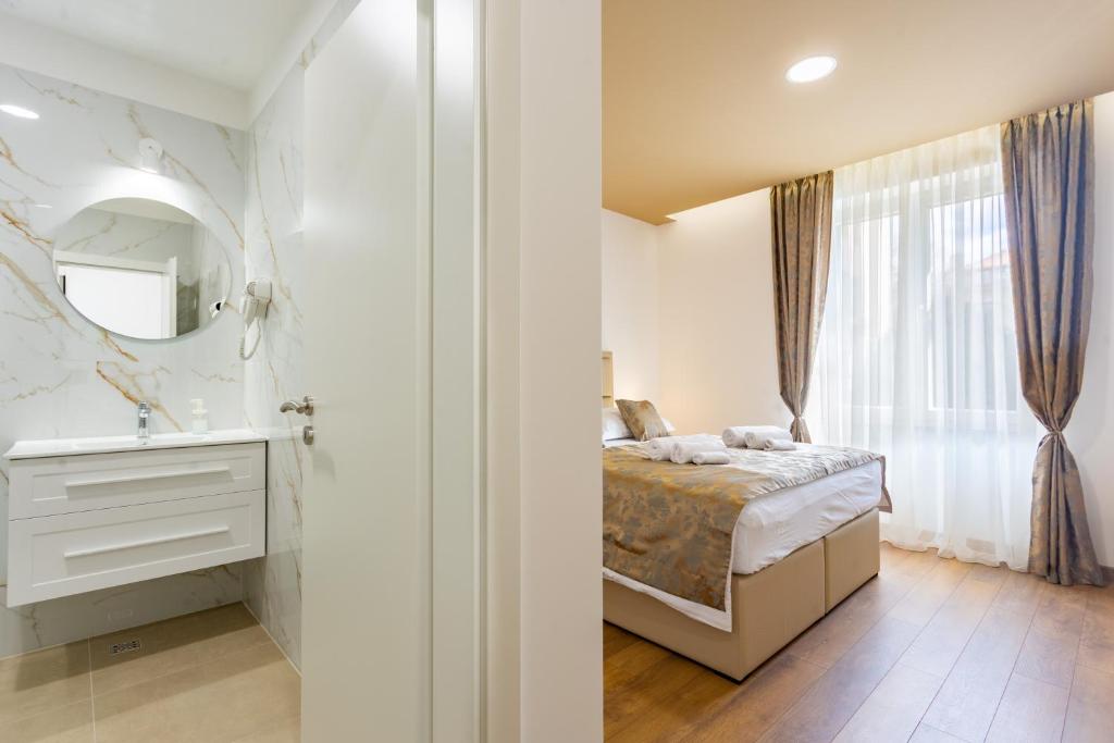 Posteľ alebo postele v izbe v ubytovaní Luxury Rooms Fetivi