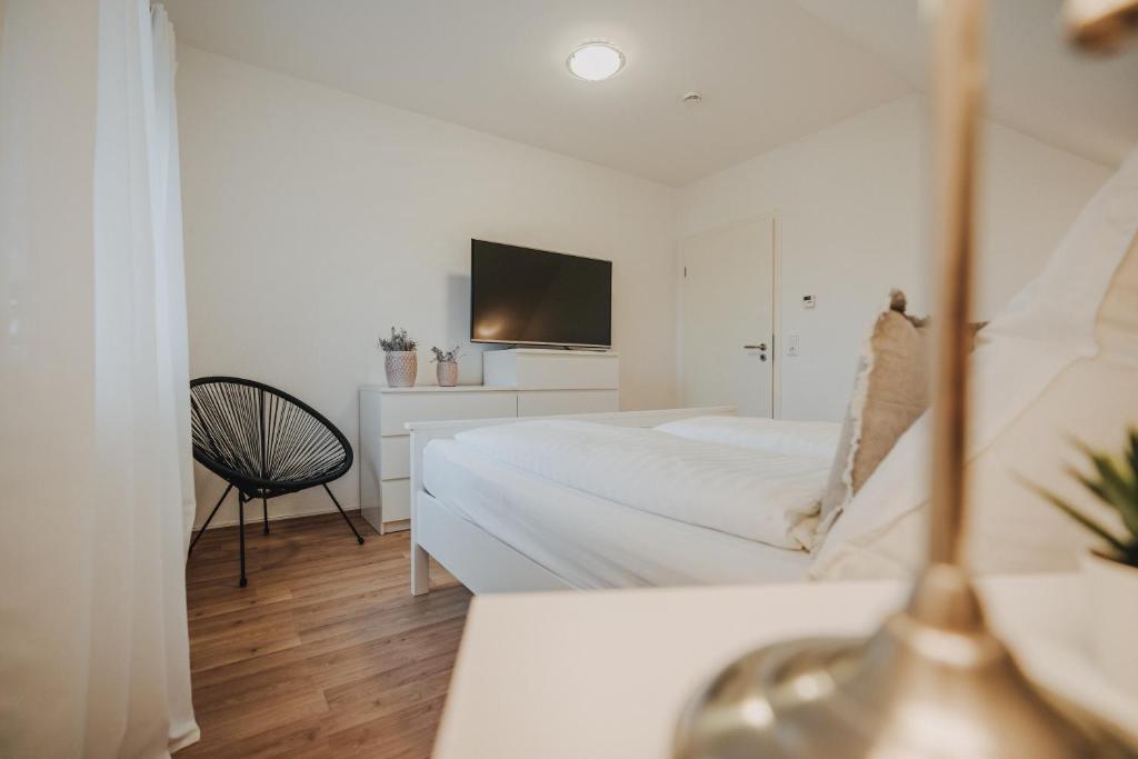 Postel nebo postele na pokoji v ubytování Ferienwohnung Weidenblick