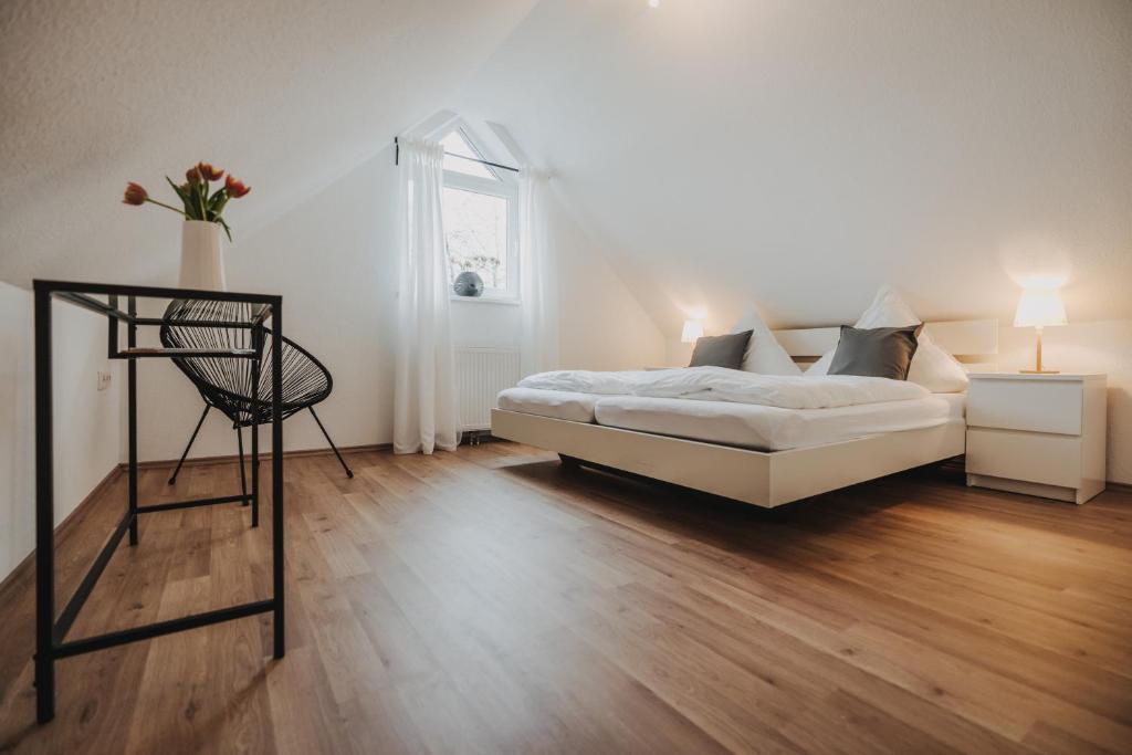 Postel nebo postele na pokoji v ubytování Ferienwohnung Weidenblick