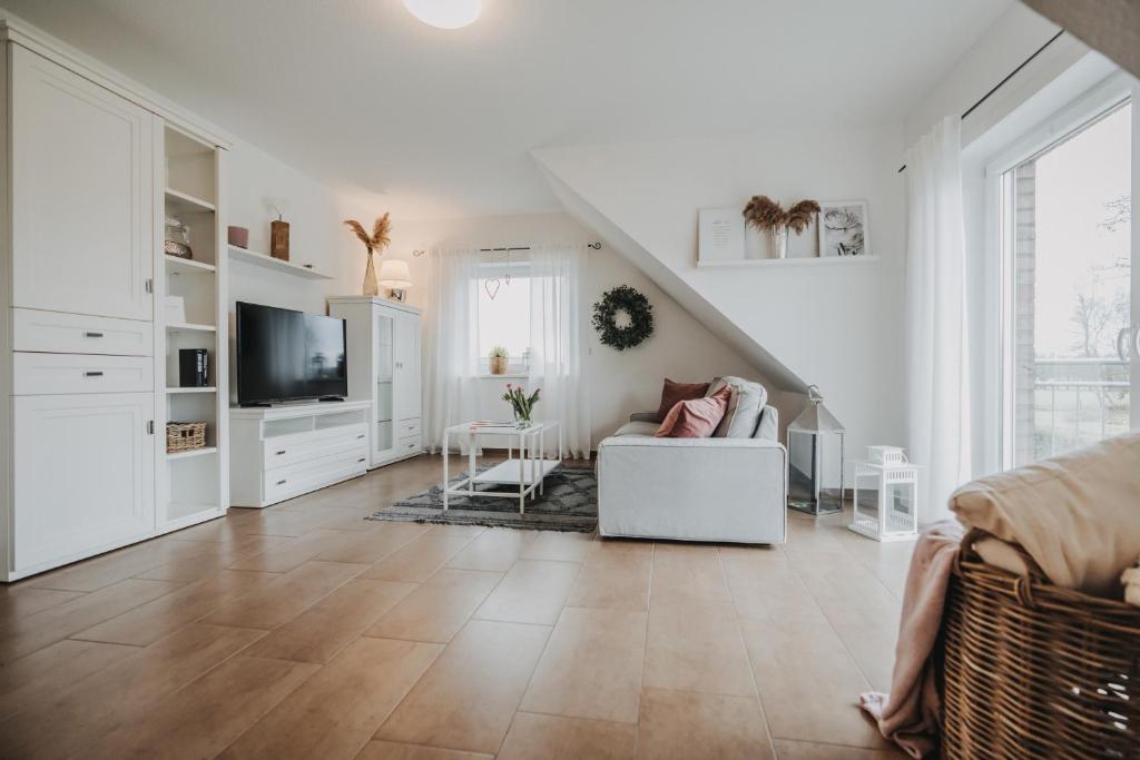 TV a/nebo společenská místnost v ubytování Ferienwohnung Weidenblick