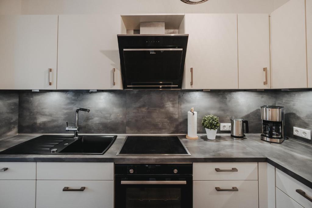 Kuchyň nebo kuchyňský kout v ubytování Ferienwohnung Weidenblick