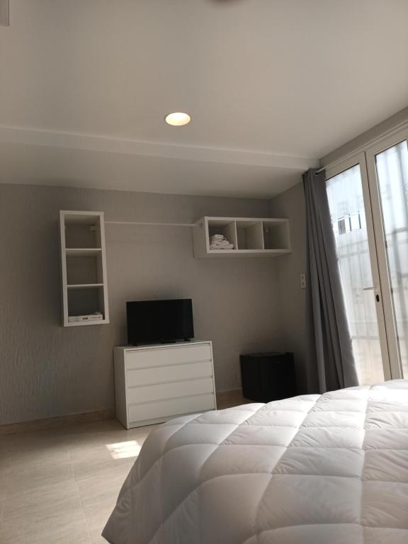 Postel nebo postele na pokoji v ubytování Hostal Cerro del Castillo jumilla