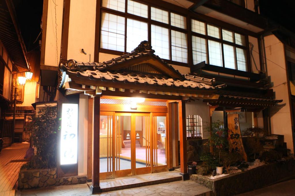 an entrance to a building with a sign on it at Hatsunoyu in Yamanouchi