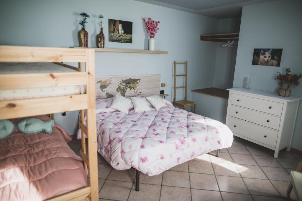 Postel nebo postele na pokoji v ubytování B&B LA MIMOSA E IL GELSOMINO