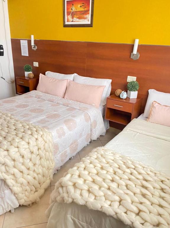 Postel nebo postele na pokoji v ubytování Hostal Alto Ayre Salta