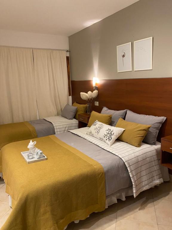 Postel nebo postele na pokoji v ubytování Hostal Alto Ayre Salta