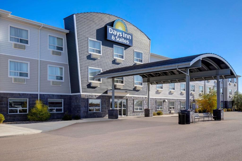 a rendering of the front of a dallas hotel at Days Inn & Suites by Wyndham Warman Legends Centre in Warman