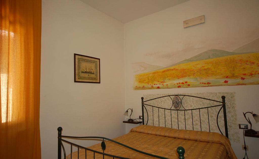 Postel nebo postele na pokoji v ubytování Hotel Leonardo