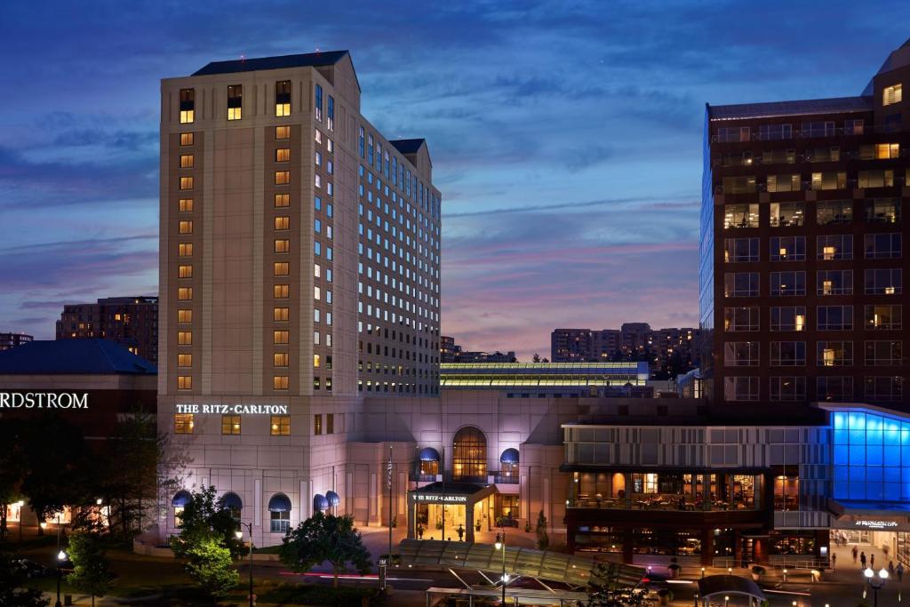 a tall building in a city at night at The Ritz Carlton, Pentagon City in Arlington