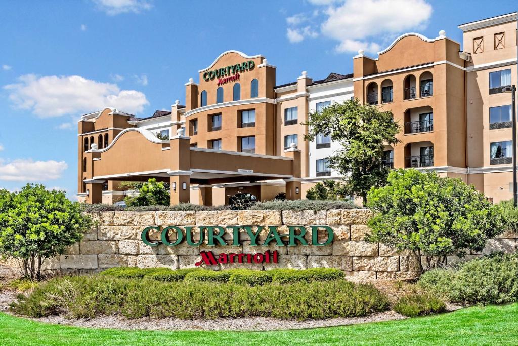 a sign in front of a building at Courtyard by Marriott San Antonio SeaWorld®/Westover Hills in San Antonio