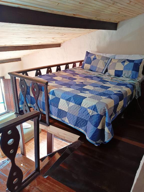 Postel nebo postele na pokoji v ubytování Suites em São Thomé das Letras