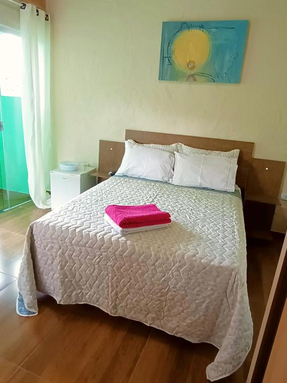 Postel nebo postele na pokoji v ubytování Suites em São Thomé das Letras