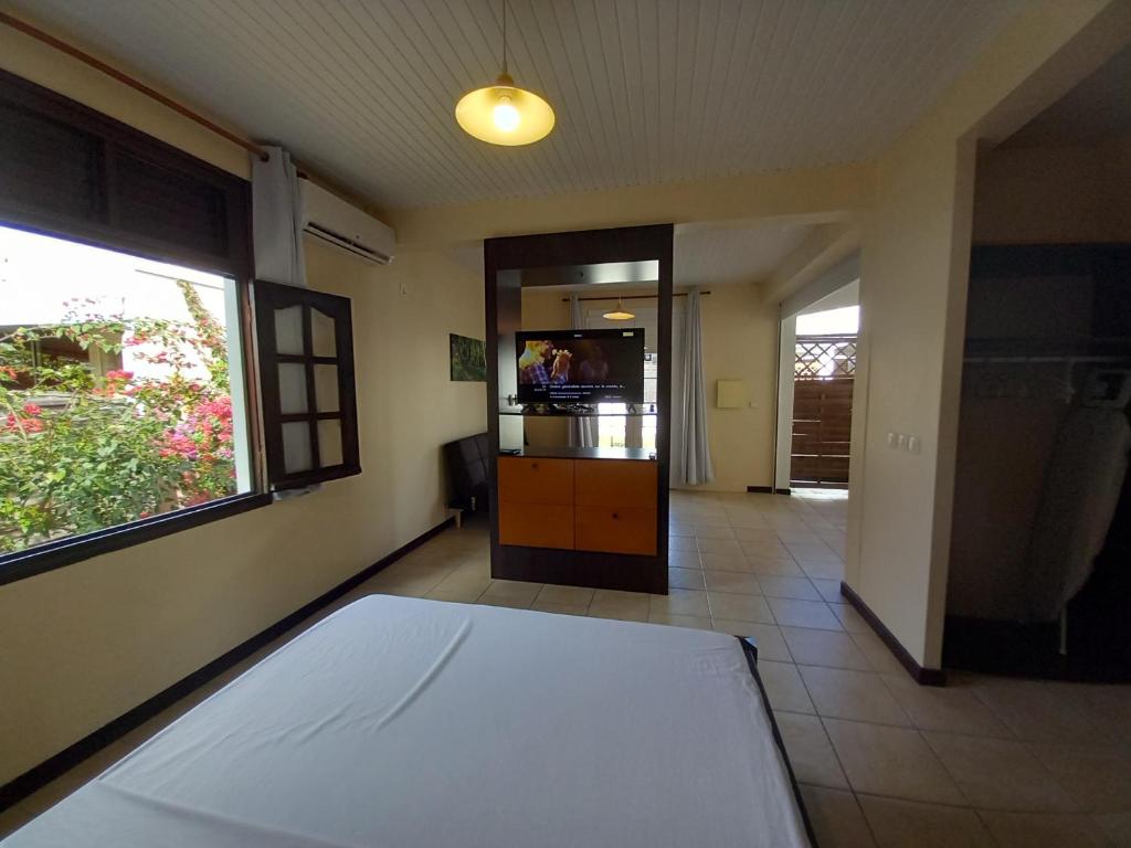 Postel nebo postele na pokoji v ubytování Vacances martinique