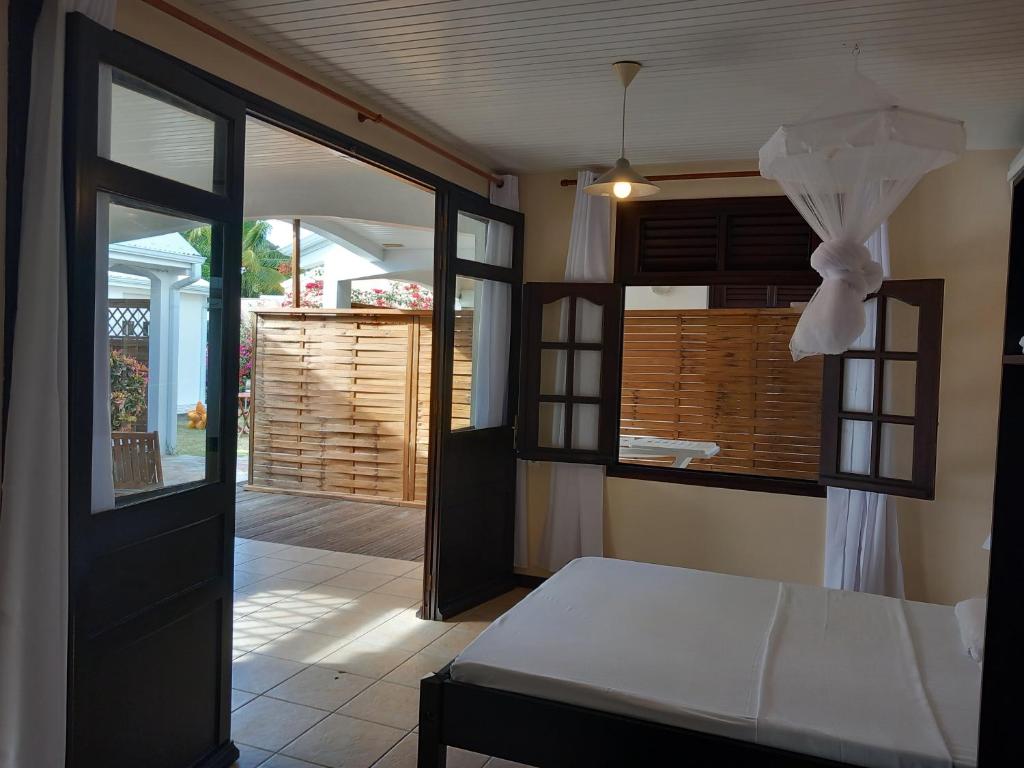 Postel nebo postele na pokoji v ubytování Vacances martinique