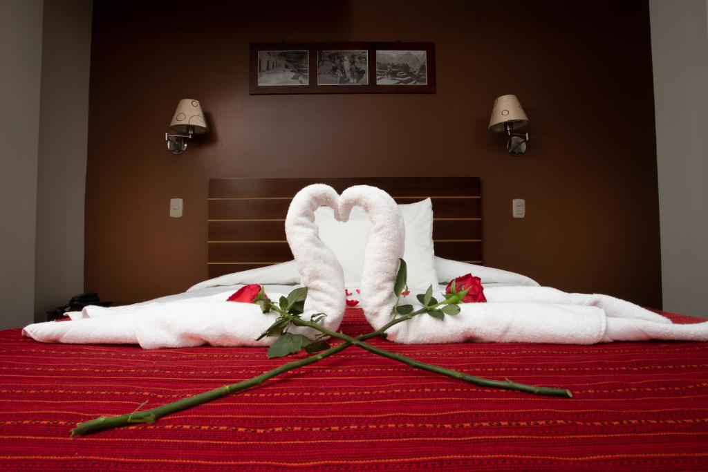 Postel nebo postele na pokoji v ubytování Kapac Inn Hotel