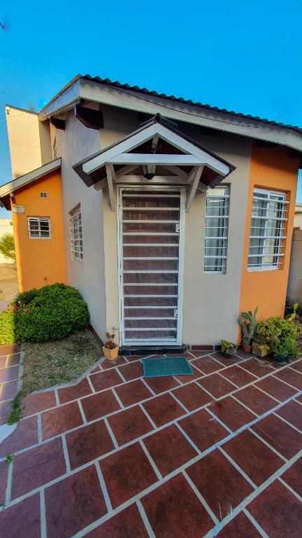 a house with a garage in front of it at La Mar in Mar de Ajó