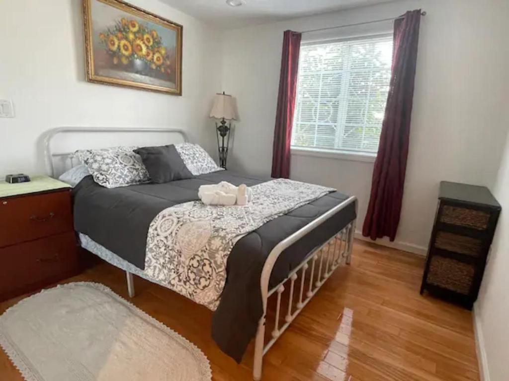 a bedroom with a bed and a window at 2 Bedroom Apartment with Parking near City College of SF in San Francisco