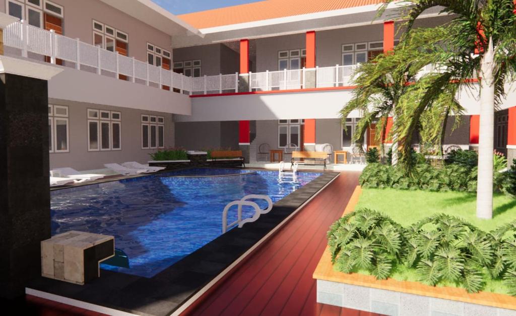 una piscina en medio de un edificio en Hotel Asri Baru en Purwokerto