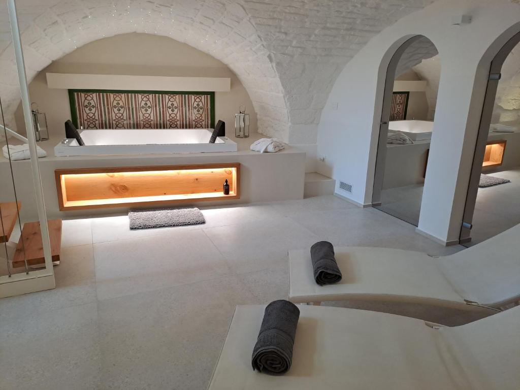 Postel nebo postele na pokoji v ubytování Palazzo AD 1892 - SUITES & SPA