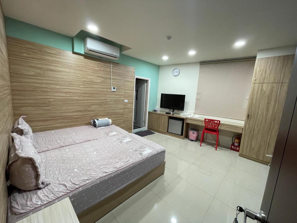 Postel nebo postele na pokoji v ubytování Lvyou B&B