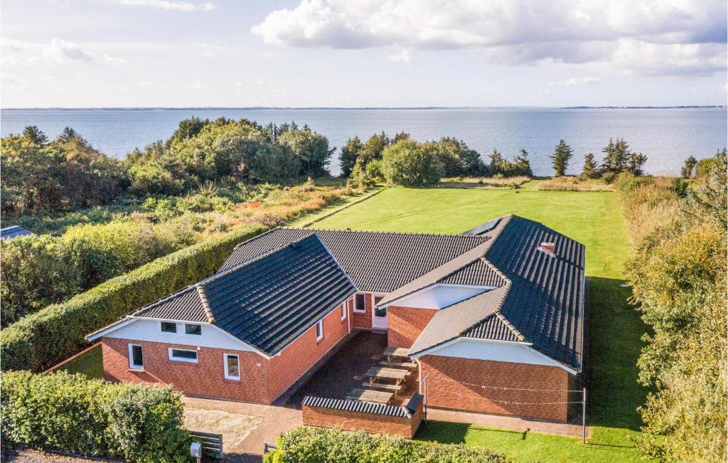 an aerial view of a house with solar panels on it at Stunning Home In Spttrup With 8 Bedrooms, Sauna And Indoor Swimming Pool in Vadum