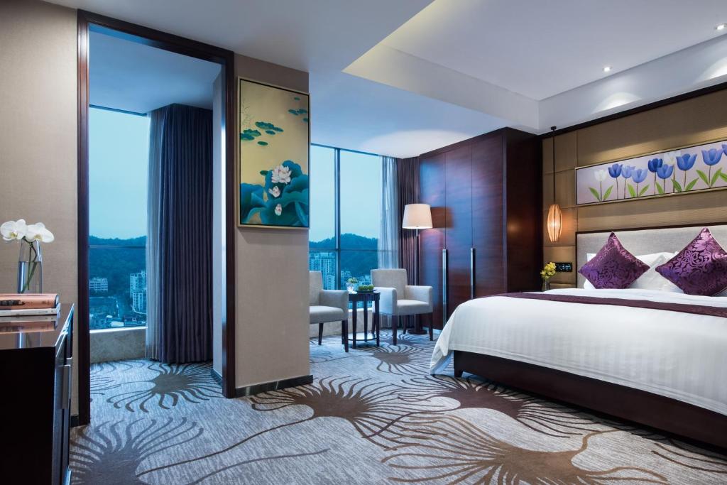 Postel nebo postele na pokoji v ubytování Guangdong Hotel (Zhuhai)