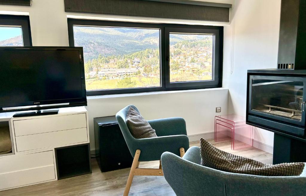 TV a/nebo společenská místnost v ubytování Luces del Poniente