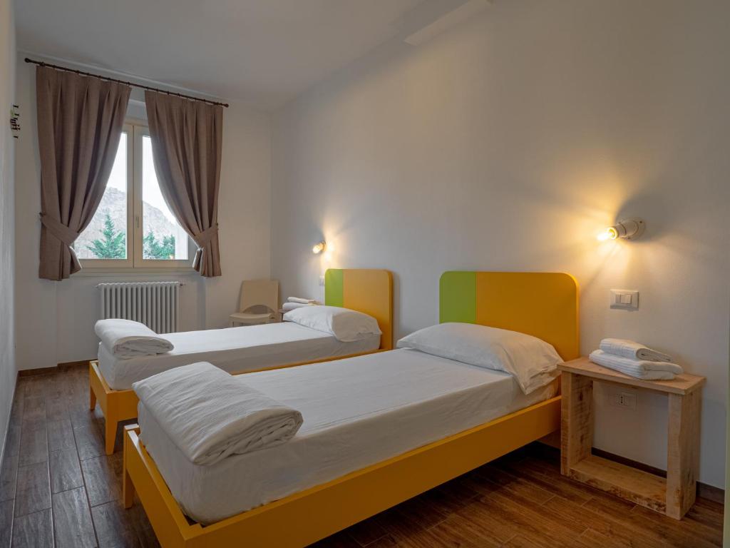 A bed or beds in a room at OASI DA VINCI