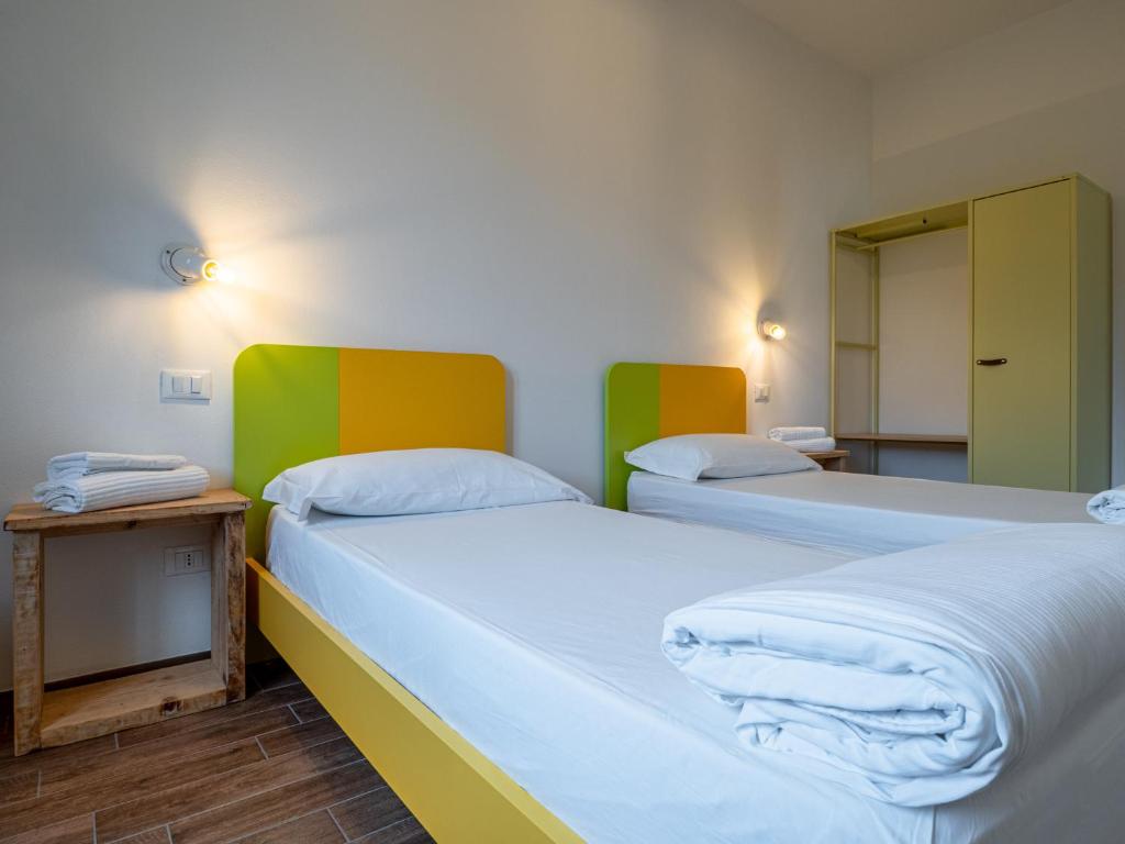 A bed or beds in a room at OASI DA VINCI