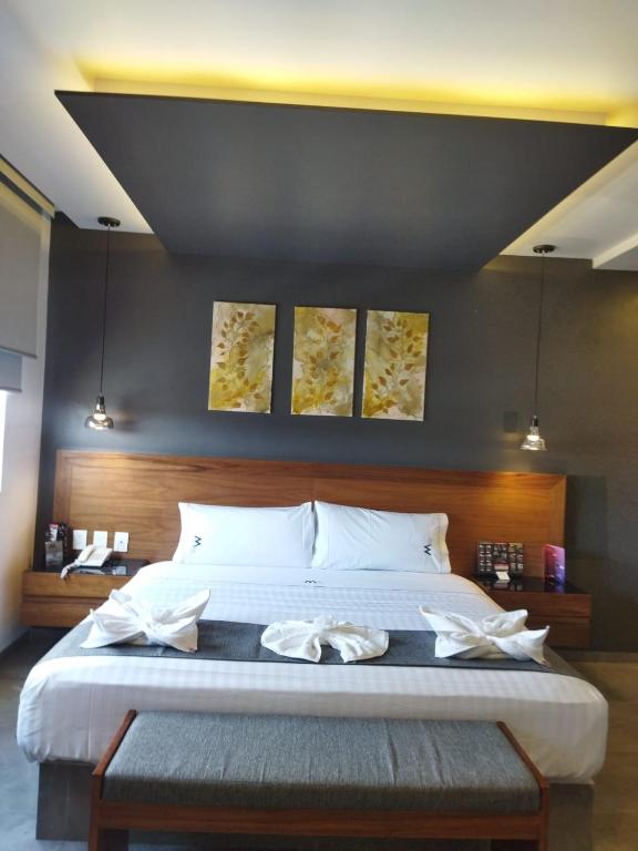 Ένα ή περισσότερα κρεβάτια σε δωμάτιο στο HOTEL M ELITE BLACK