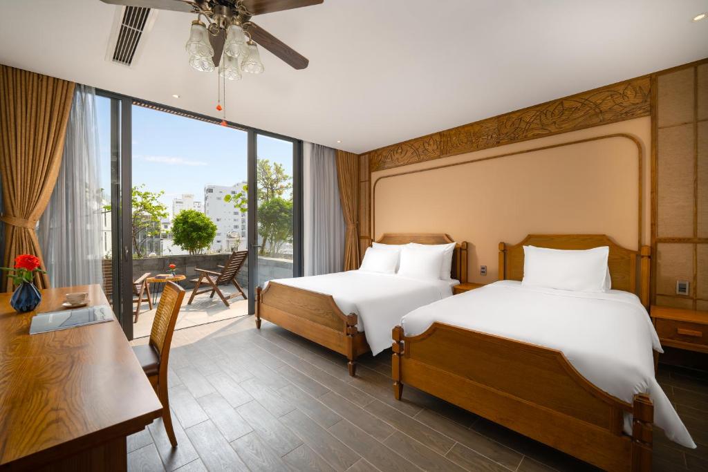Giường trong phòng chung tại VernalHome Boutique Danang