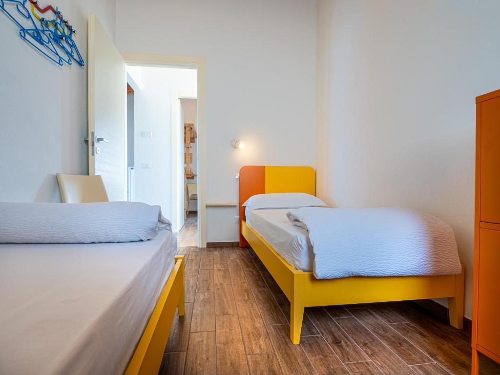 A bed or beds in a room at OASI DA VINCI