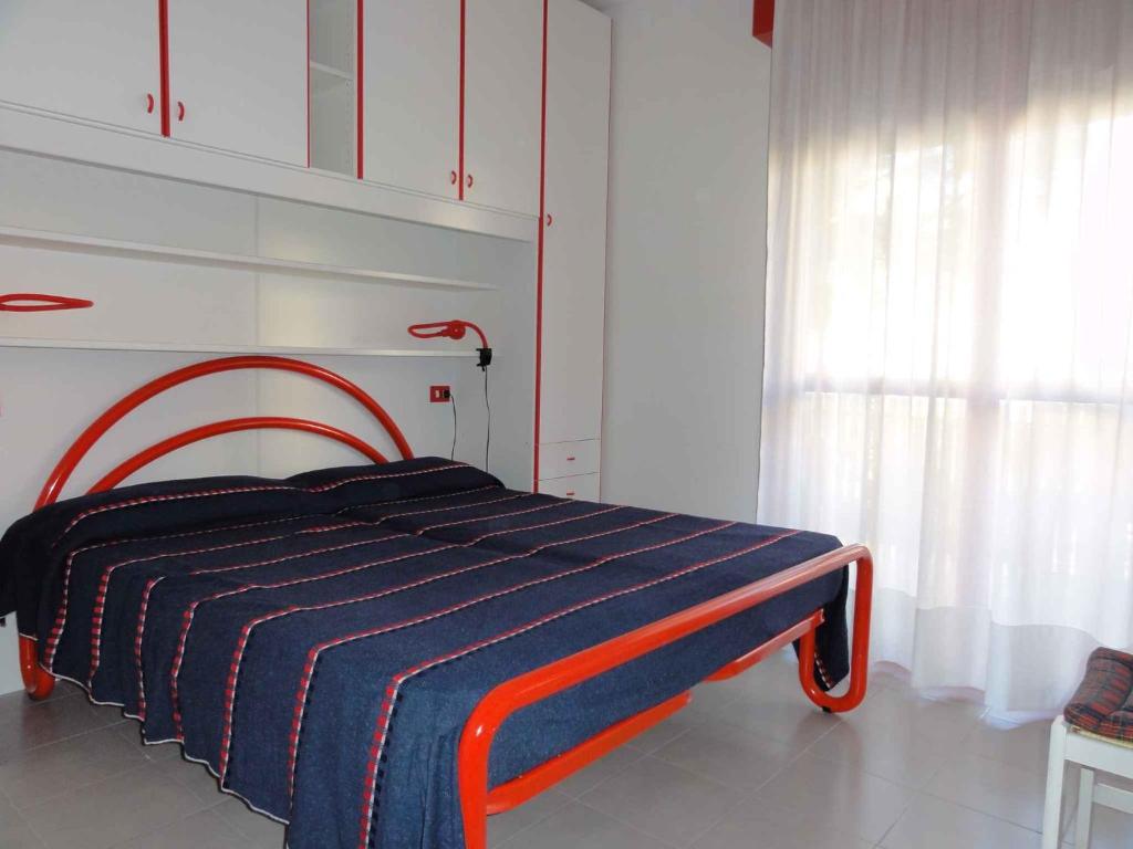 Ένα ή περισσότερα κρεβάτια σε δωμάτιο στο Apartment in Bibione 38277