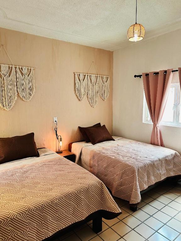 Postel nebo postele na pokoji v ubytování Casa Valentía