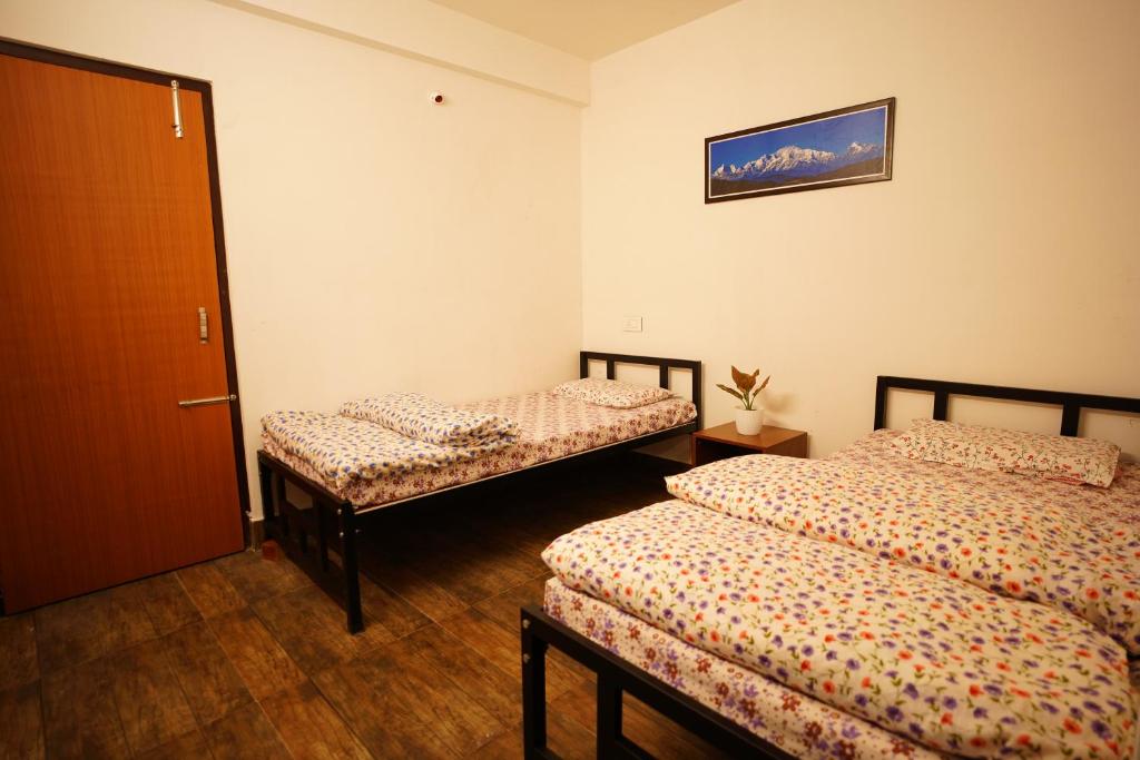 Postel nebo postele na pokoji v ubytování HIMALOK HOMESTAY