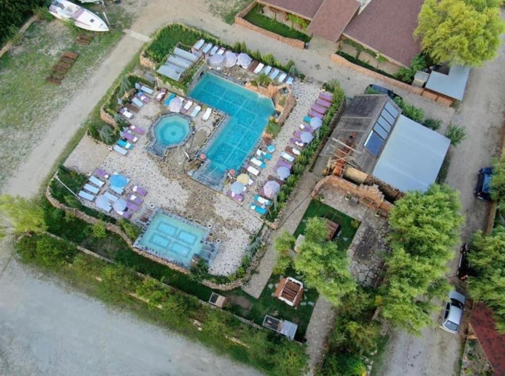 an overhead view of a swimming pool and a resort at Pensiunea BELVEDERE YACHTCLUB Berzasca in Berzasca